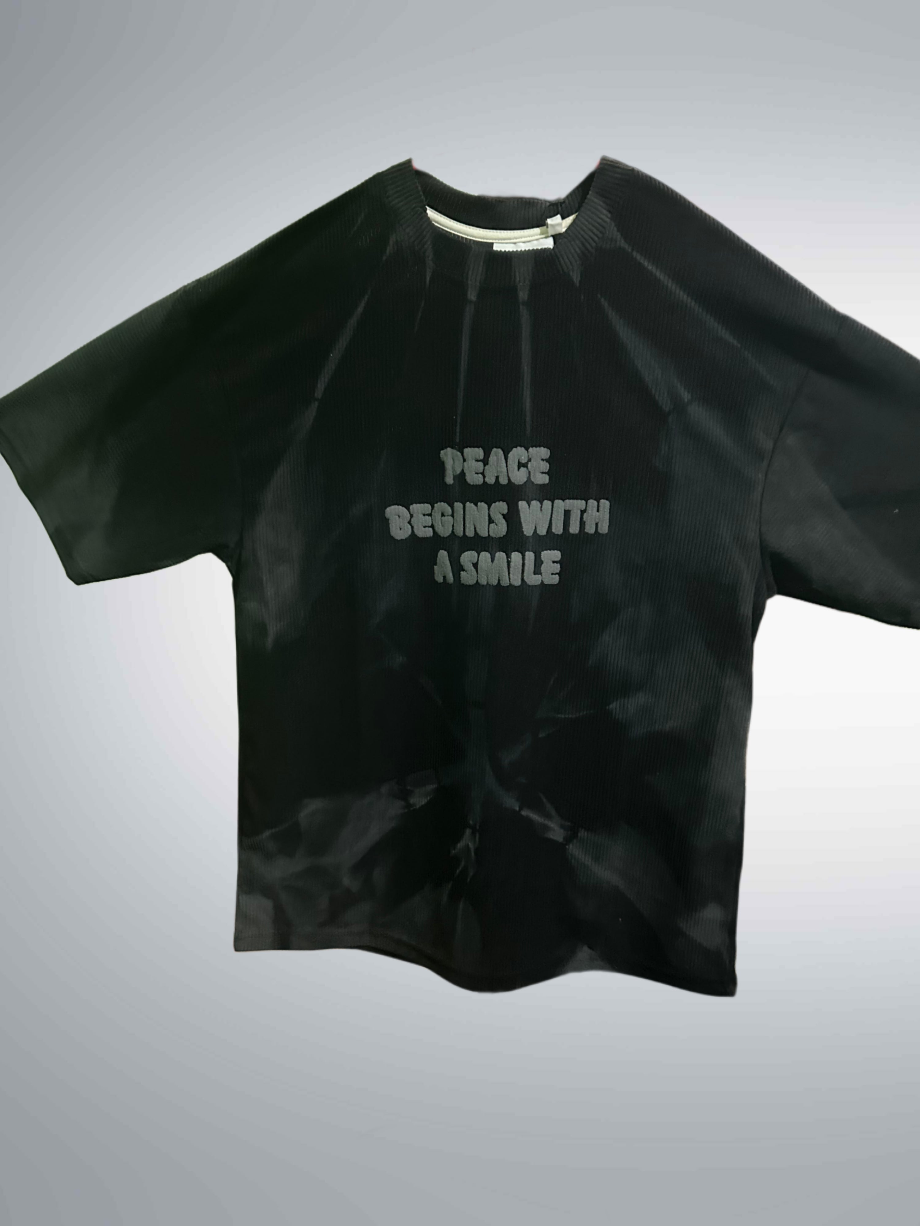 brown tie-dye t-shirt with a bold